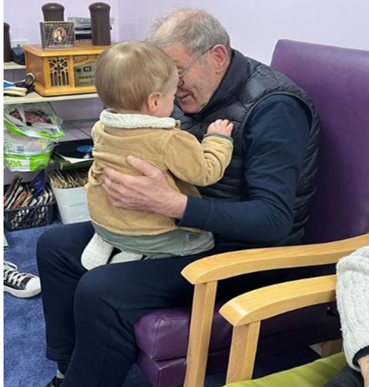 Intergenerational Peep - having a bosie Intergenerational Peep - having a bosie