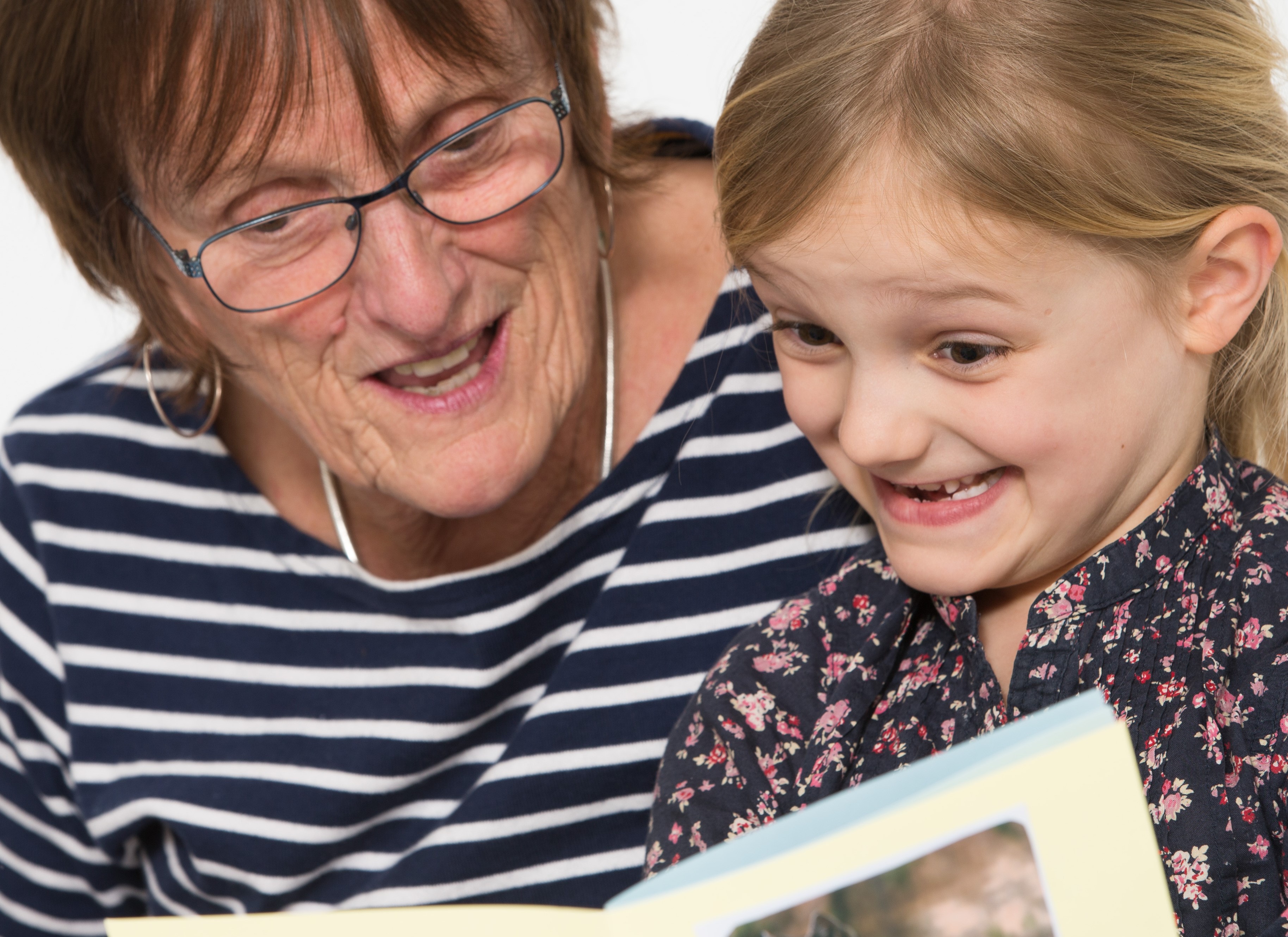 looking at homemade book together looking at homemade book together