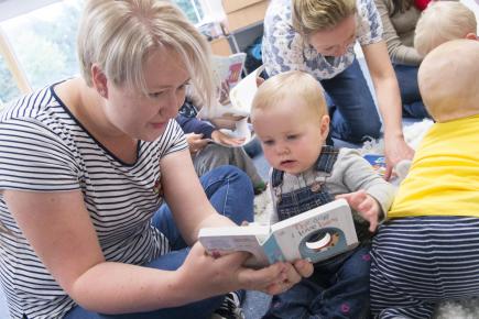 Mum reads with baby