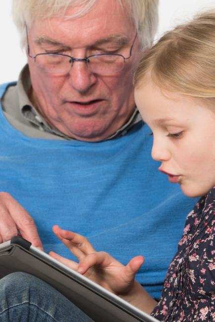 interacting with tablet and grandad