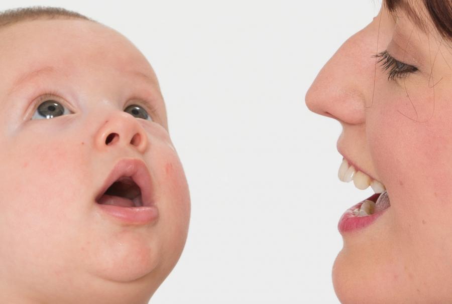 Mum copying mouth shape of baby